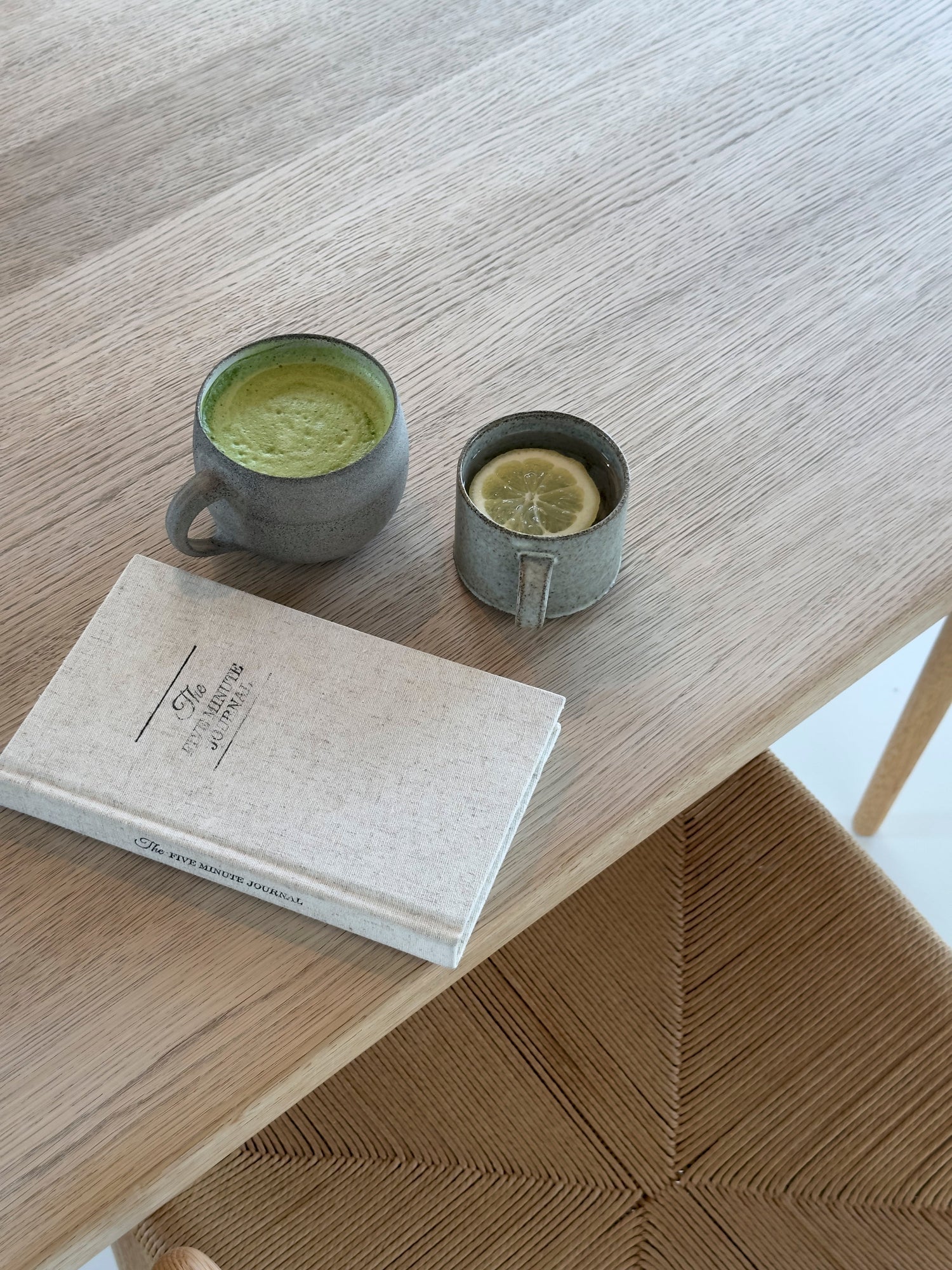 Health + Wellness collection featuring healthy drinks and a book on a wooden table.