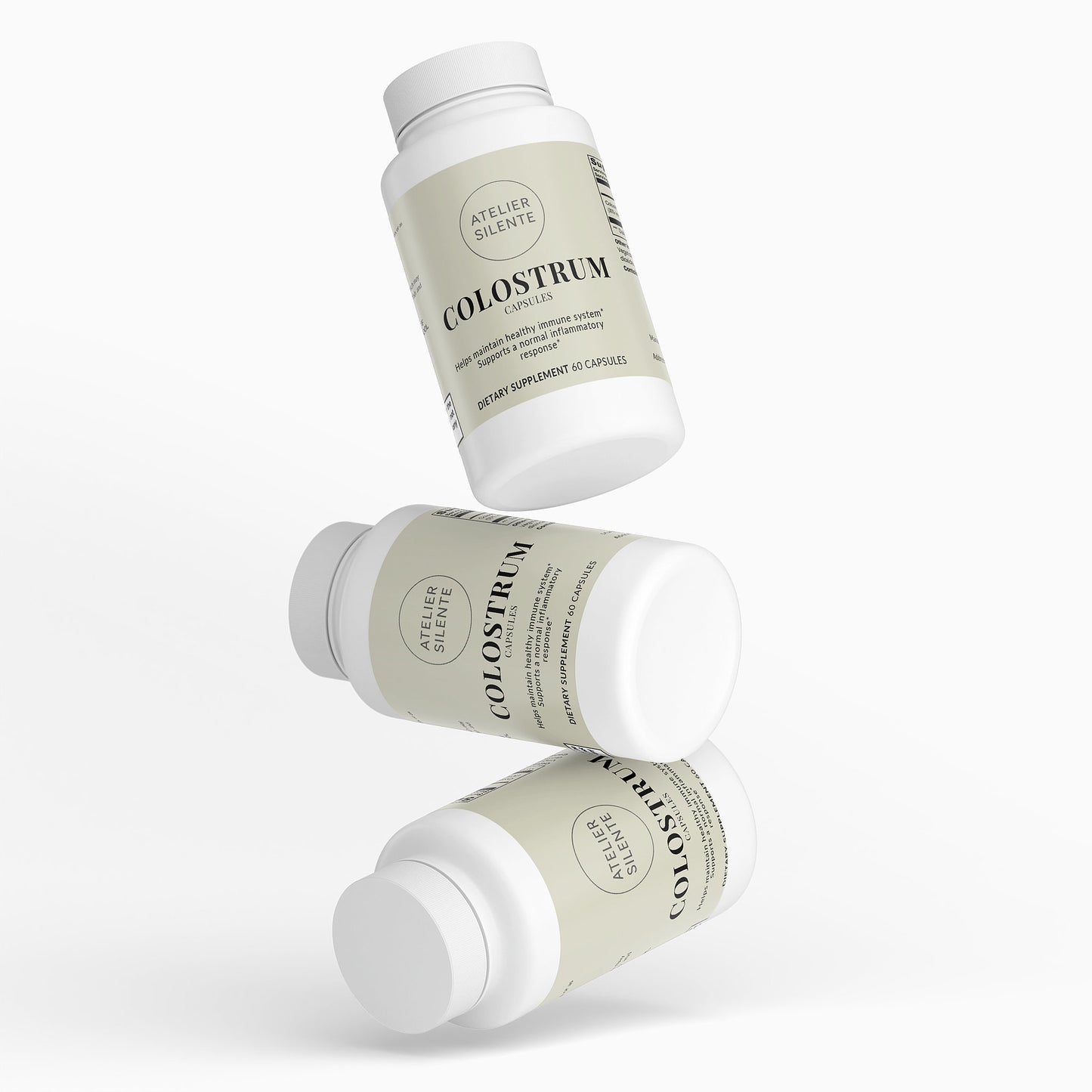 Three bottles of Colostrum Capsules stacked, highlighting digestive comfort and immune support.