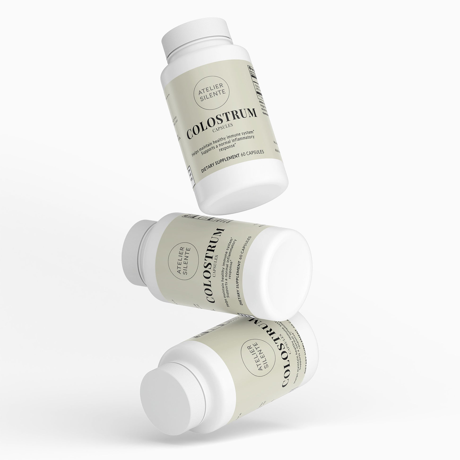 Three bottles of Colostrum Capsules stacked, highlighting digestive comfort and immune support.
