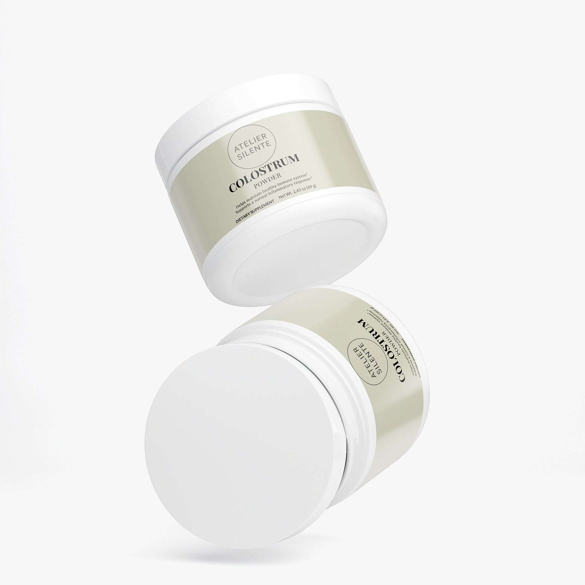 Two jars of Colostrum Powder designed for gut comfort and immune support.