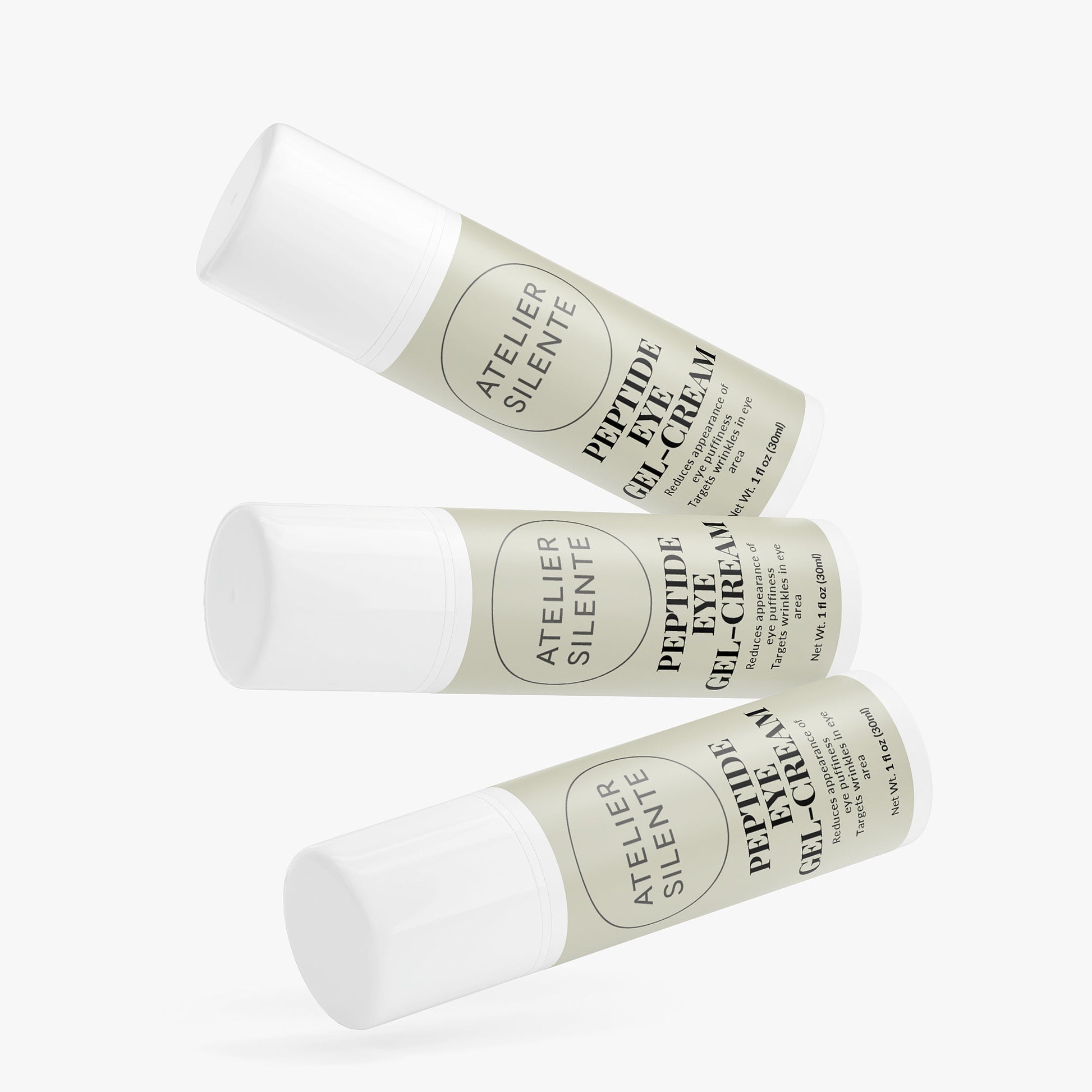 Three tubes of Peptide Eye Gel-Cream by Atelier Silente stacked together on a white background.