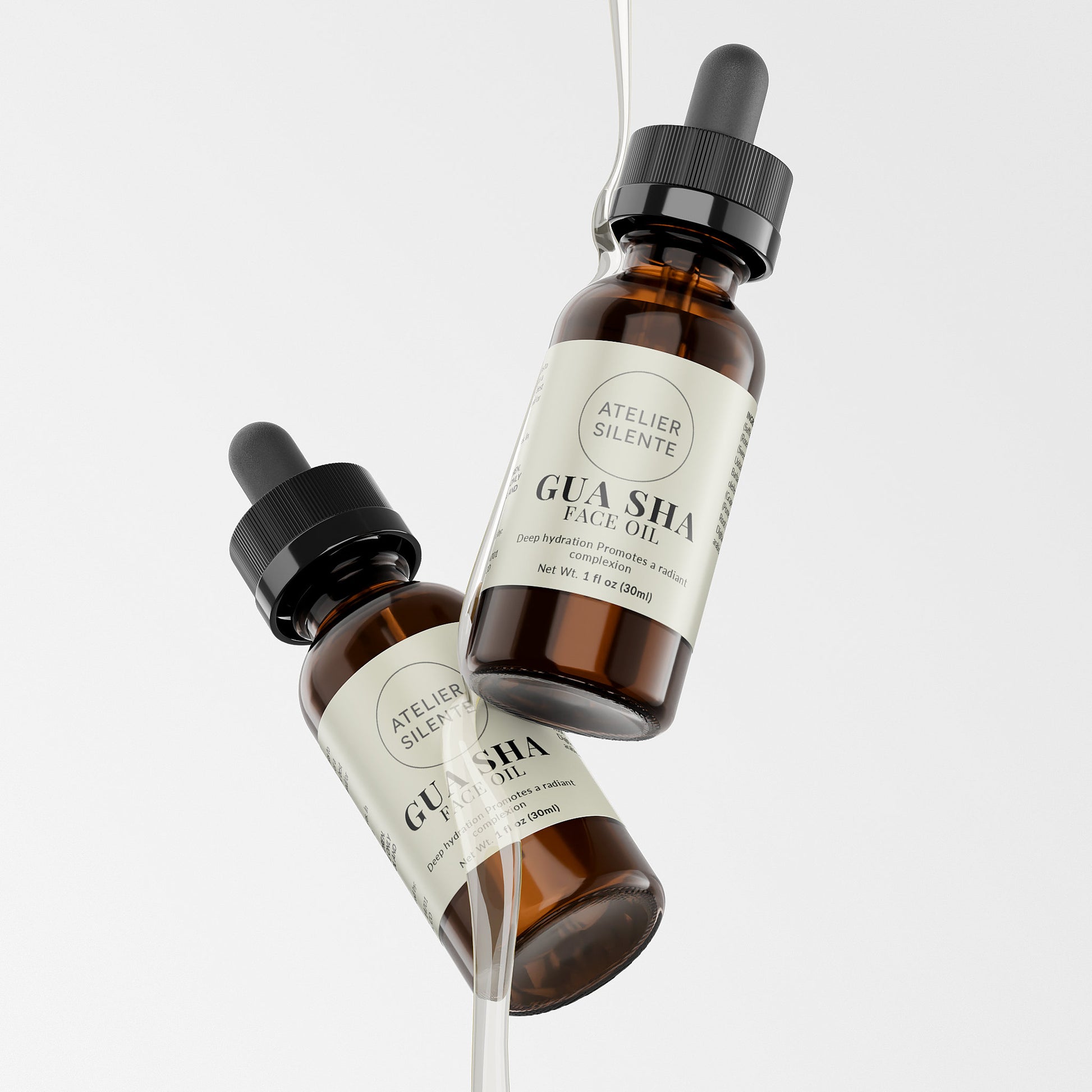 Two bottles of Gua Sha Face Oil from Atelier Silente, showcasing silky texture and glow.