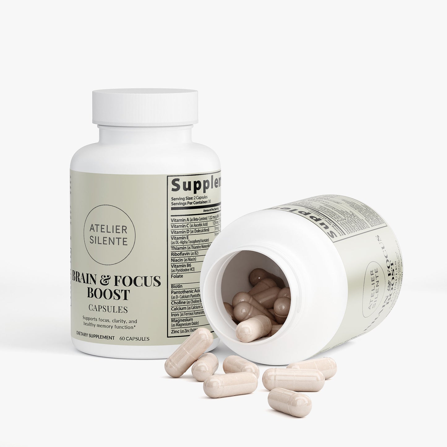 Brain & Focus Boost dietary supplement capsules in a bottle with some capsules spilled out.