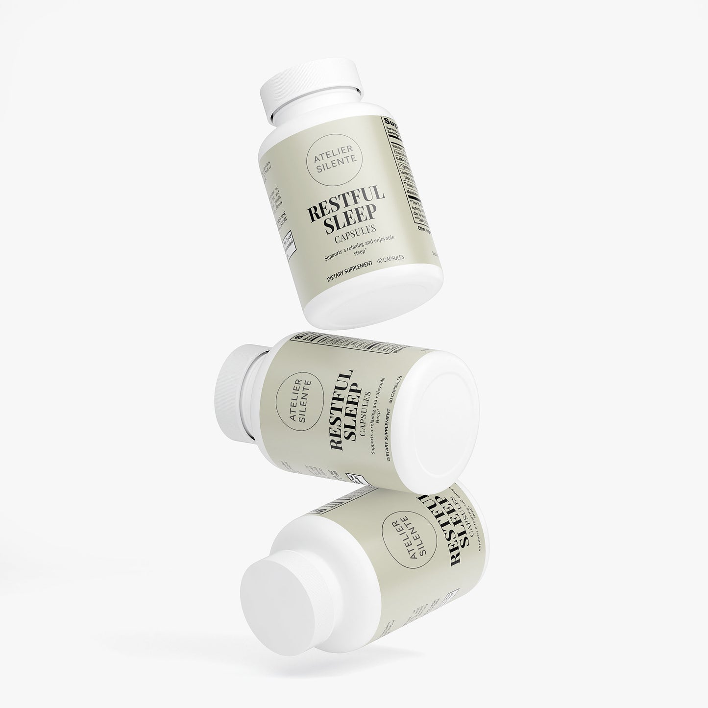 Three bottles of Restful Sleep capsules designed to promote better sleep and reduce grogginess.