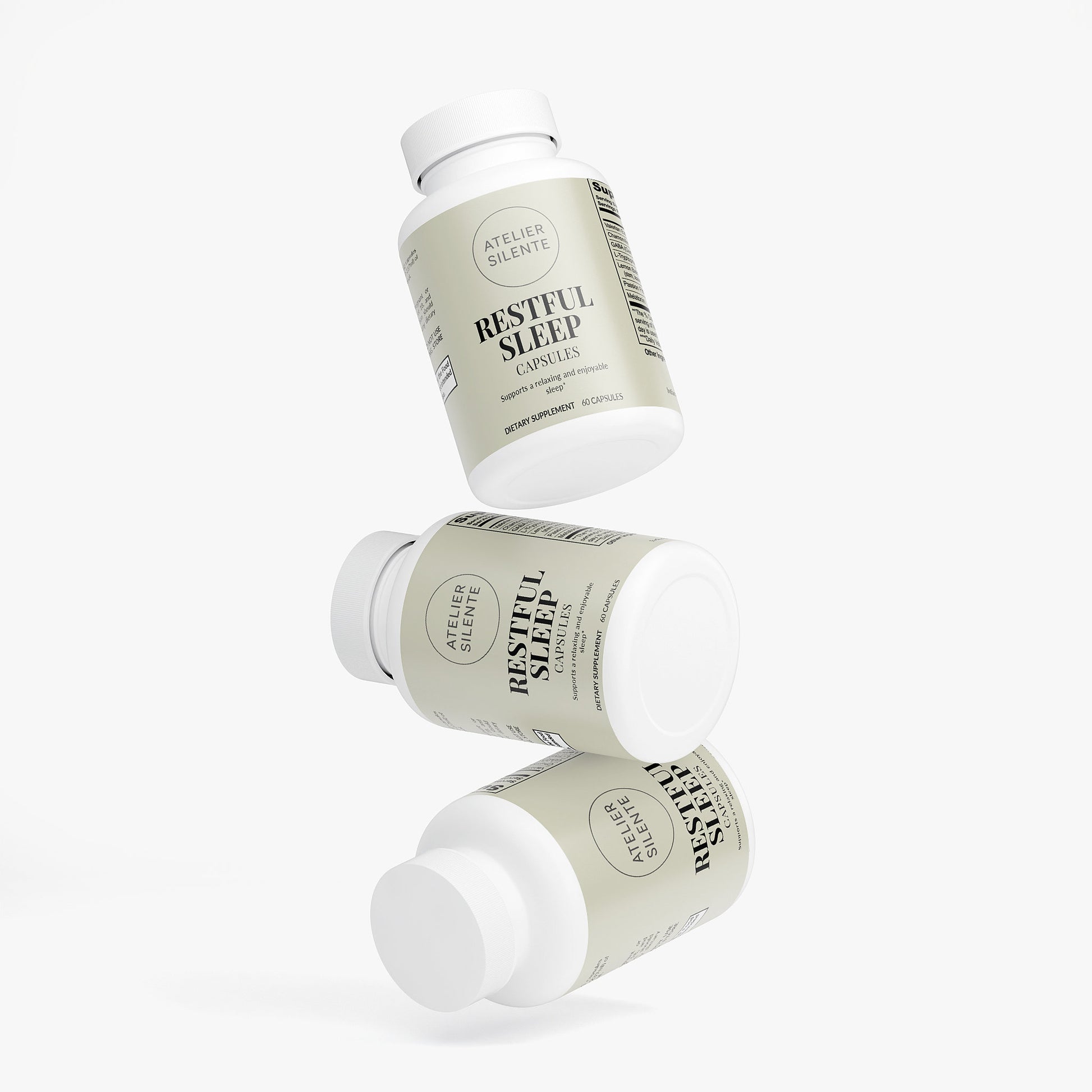 Three bottles of Restful Sleep capsules designed to promote better sleep and reduce grogginess.