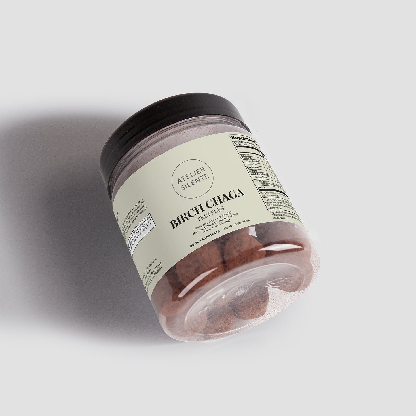 Birch Chaga Functional Truffles in a clear jar, showcasing earthy cacao bites for gut comfort and antioxidant energy.