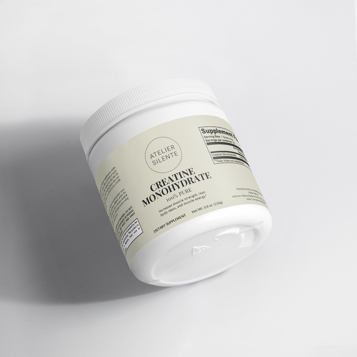 Creatine Monohydrate supplement container on a clean surface.