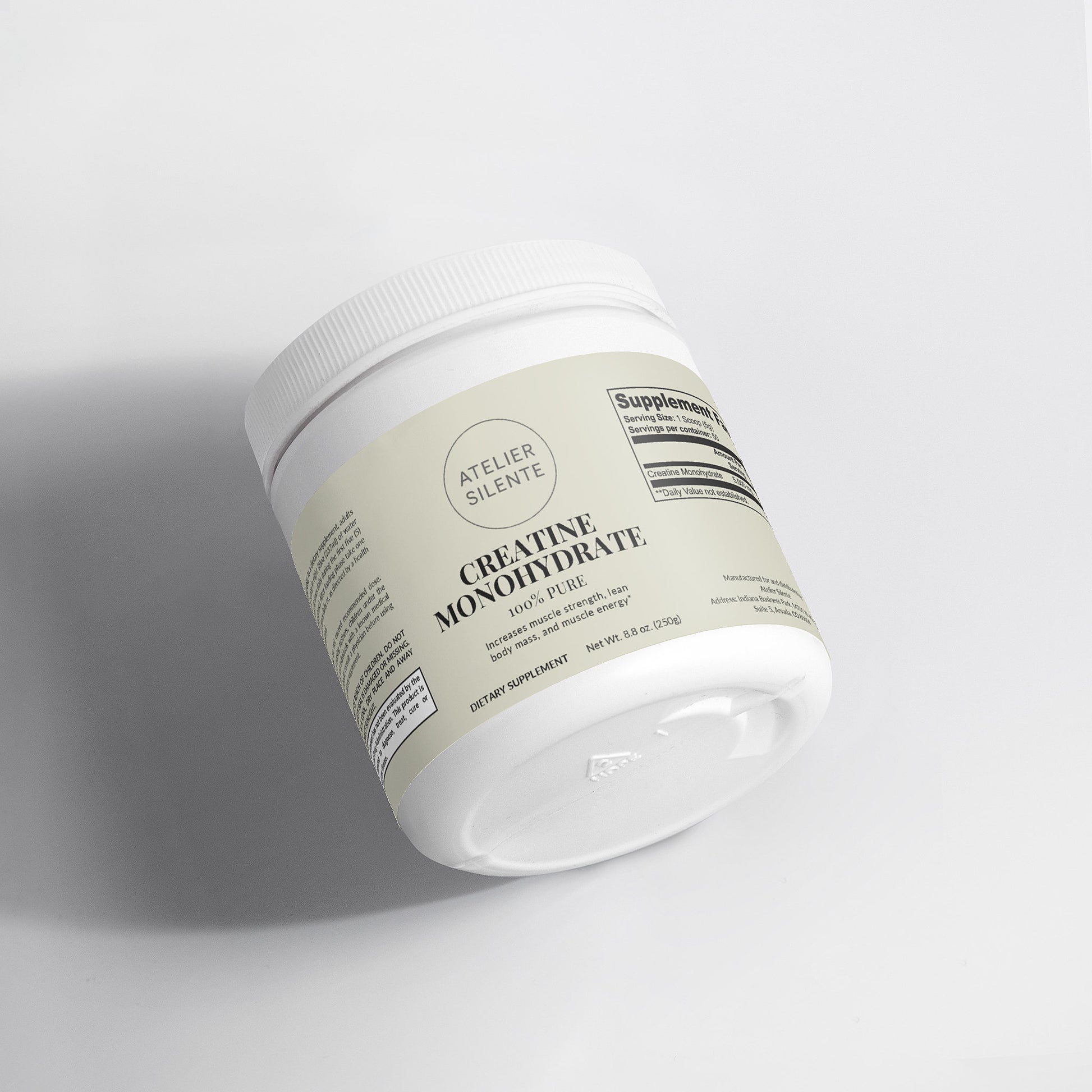 Creatine Monohydrate supplement container on a clean surface.